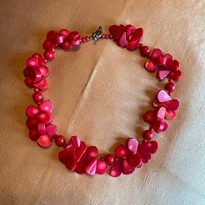 Red stone necklace with silver tone clasp.